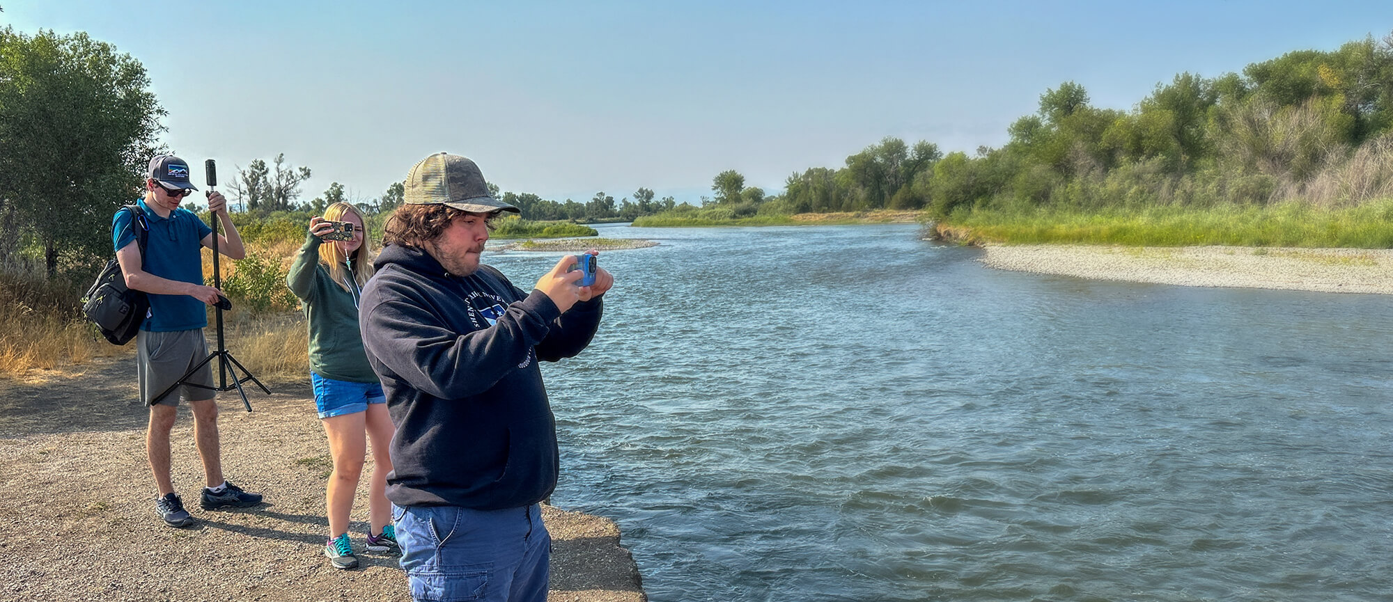 Tyler Dossat '25, Ann Fink '25, and Joey Miciotta '24 capture 360 footage at the headwaters of the Missouri River during a cross-country expedition following in the footsteps of Lewis and Clark's Corps of Discovery.