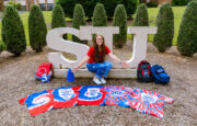 Victoria Hannen with the orientation T-shirts she's collected since 2019.