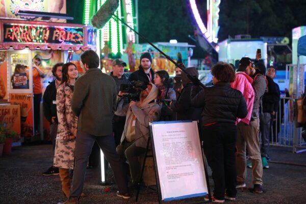 "Miss Valentine" cast and crew film a scene during the Apple Blossom Festival carnival.