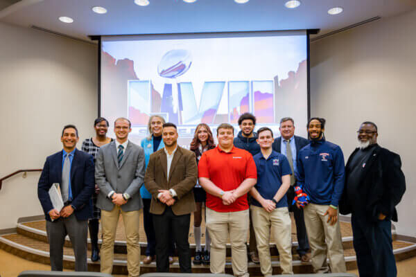 Shenandoah University students, faculty and staff pose for a photo in Stimpson Auditorium