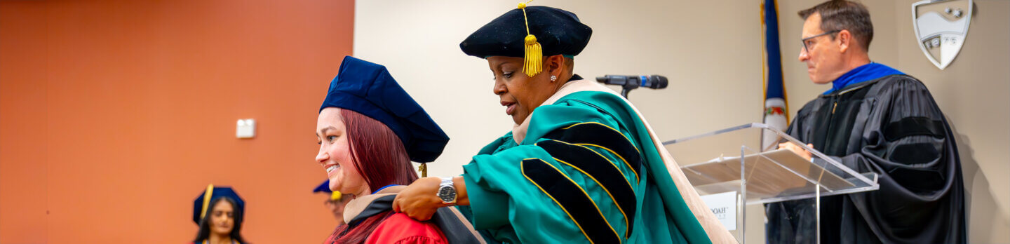 Business school hooding ceremony | BBA to MBA program page header