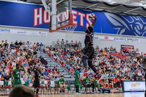 A Harlem Globetrotters player throws down a slam dunk during an event at Shenandoah University in 2021