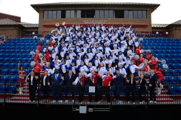 The 2025 Shenandoah University Marching Band celebrates in the stands.