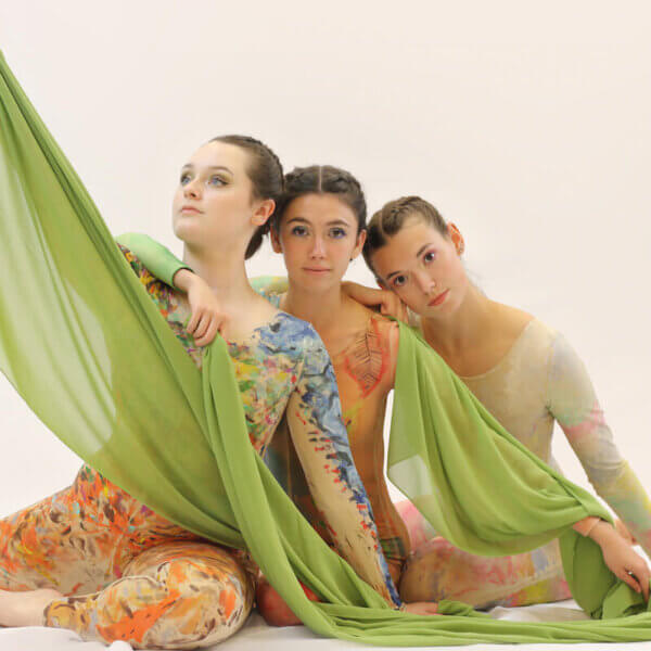 From left to right - Becca Hopkins, Eve Stanley and Lainey Griffin, wearing hand-painted costumes for Arte in Movimento dance company's "Walking Artwork" show. All three are Shenandoah graduates, and Stanley is the artistic director of the dance company.