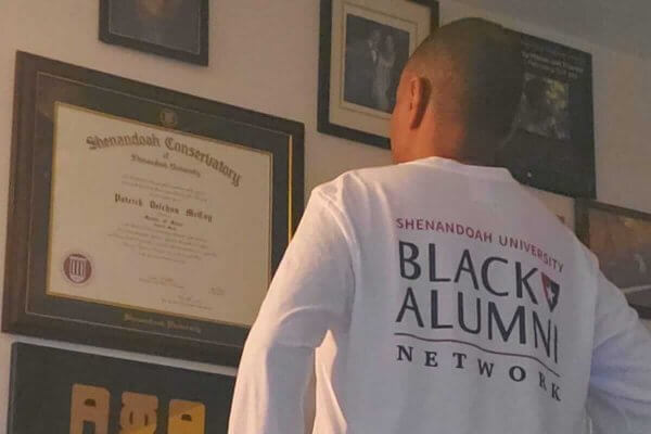 Shenandoah University Black Alumni Network member Patrick McCoy with his Shenandoah degree.