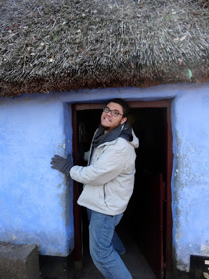 Ireland - student poses in Hobbit door