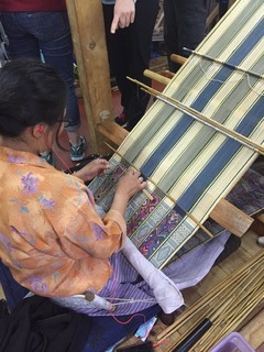 Woman weaving traditional rub