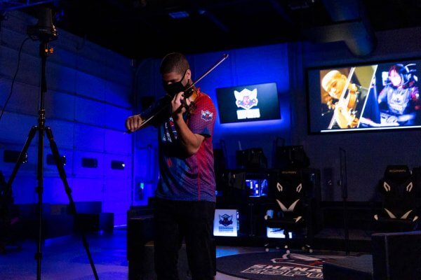 Musician performing inside the esports arena