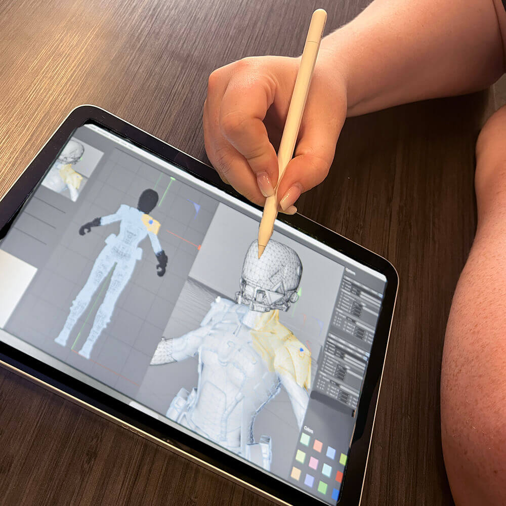 Student using 3D modeling on iPad