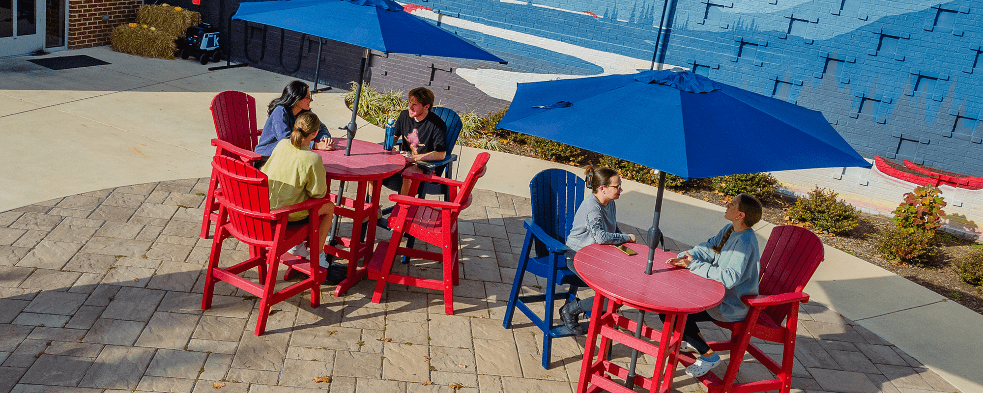 Students at tables outside the BSC