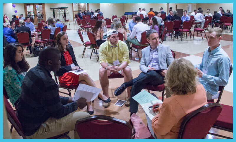 Students across academic disciplines interact with faculty mentors and community participants in the first general education town hall event in April.