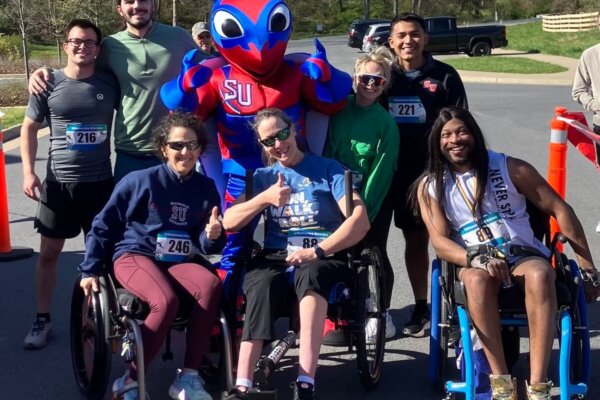 Group gathered for the inaugural Buzzy's Race for Research organized by Shenandoah University physical therapy students in April 2024. Group includes wheelchair users who "rolled" at the event, which benefits The Foundation for Physical Therapy research awards