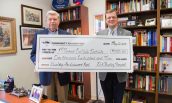 Dr. Robert F. Boxley, Jr. (left) presents a check to Director of the CWI Jonathan Noyalas (right).