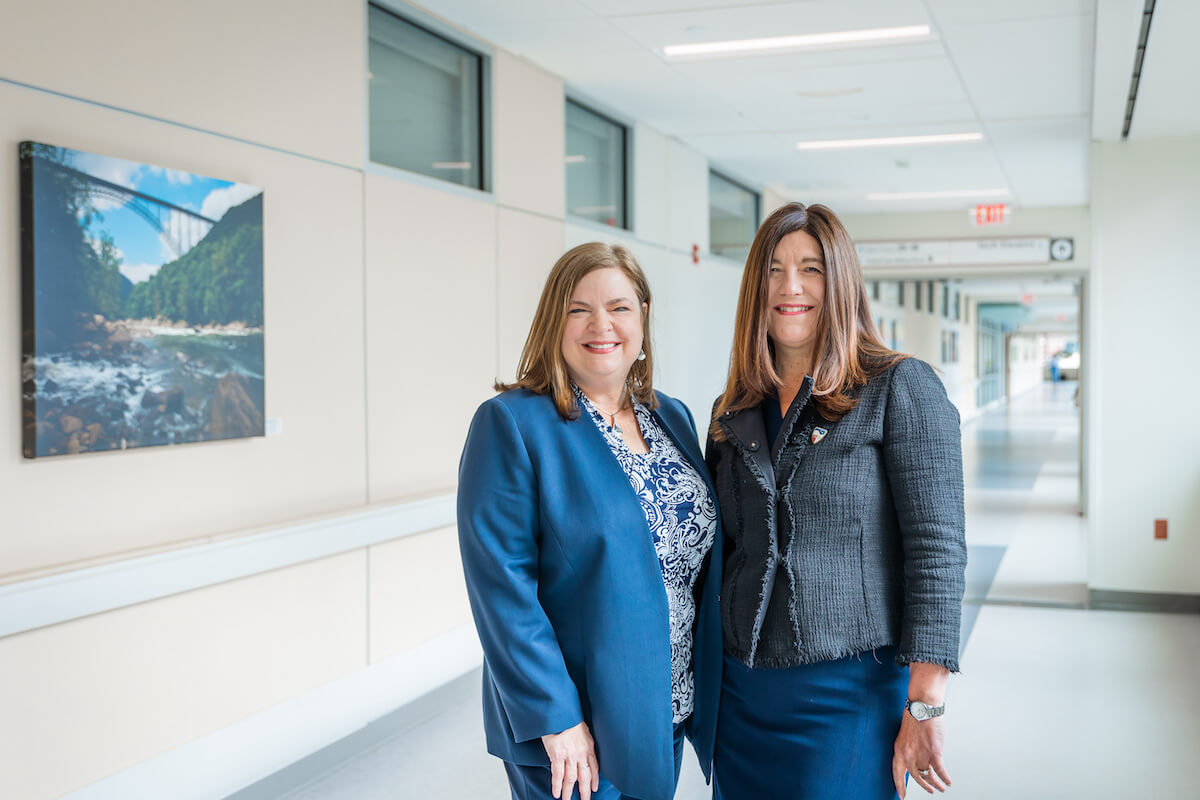 Valley Health Chief Nurse Executive Theresa Trivette and Lisa Levinson, acting dean of Shenandoah University's Eleanor W. Custer School of Nursing, pose for a photo at Winchester Medical Center