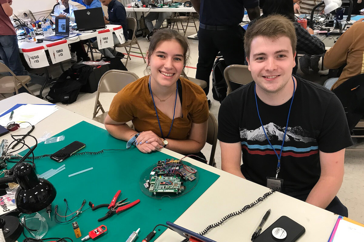 Shenandoah students Shannon Eissele and Connor Hill sitting at their workstation at NASA's RockOn workshop