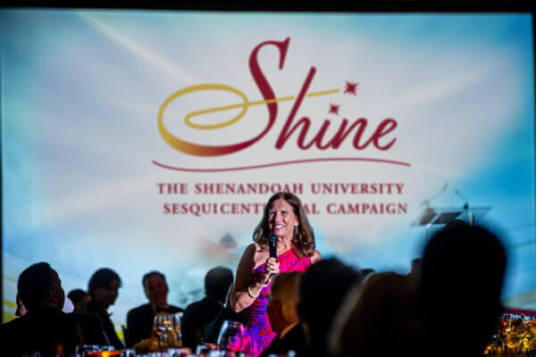 University President Tracy Fitzsimmons greets guests at sesquicentenneial gala