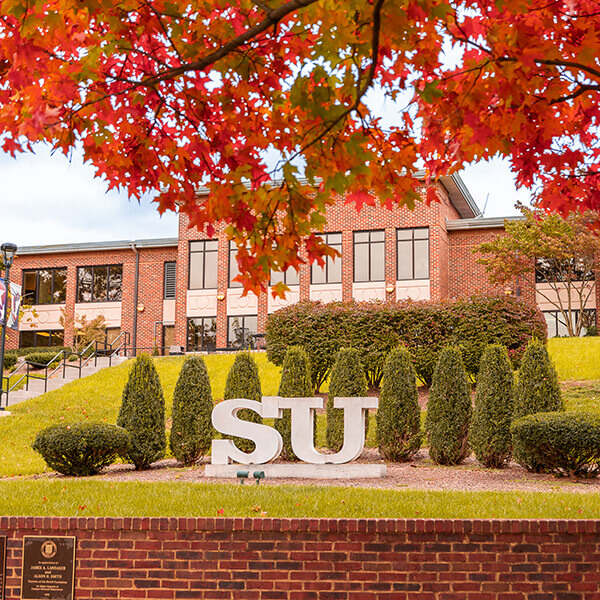 The SU statue in front Wilkins in autumn