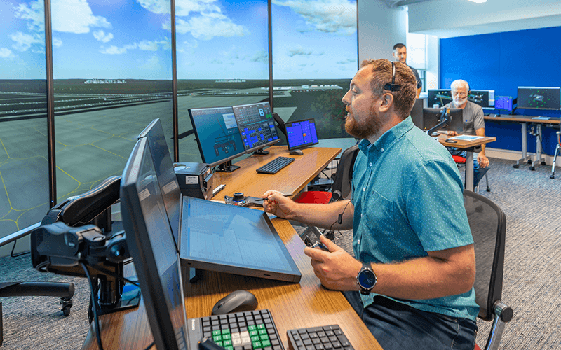 Air Traffic Control sim lab with a person at a computer