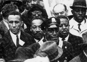 The Rev. Gilbert H. Caldwell (left) walks with the Rev. Martin Luther King Jr. (second from left). Photo courtesy of the Rev. Gilbert H. Caldwell.