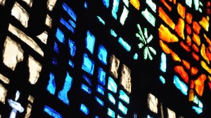 Close up photo of stained glass window in Goodson Chapel