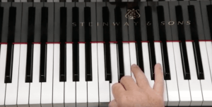 John O'Conor plays with thumb under to improve piano scale speed.