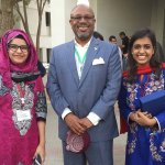 Two attendees at the Entrepreneurship Educators Symposium flank Dean Davis. These young women, both students, consulted Davis about traveling to U.S. to study at the Harry F. Byrd, Jr. School of Business.