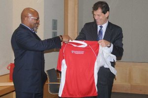 Dr. Markus Rodlauer, deputy director of the IMF, presents Dean Davis with a t-shirt. 
