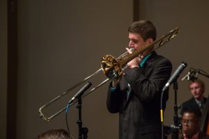 Photo of Shenandoah Conservatory trombonist Nathan Davis playing trombone. Davis was selected for the Disneyland All-American Band for 2017.
