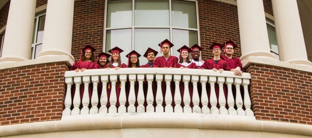 Karen Huff with new Handley graduates she first met as first-grade students