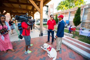 De'Angelo Wynn and his service dog, Jug, with a FOX 5 DC crew during the channel's summer 2018 "Zip Trip" to Winchester.