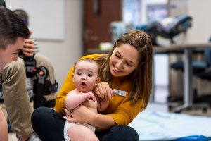 Baby Lab photo of student with baby at Shenandoah University