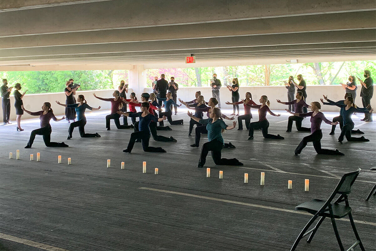 Choirs and Dance Ensemble Collaborate on Outdoor Performance in Parking Garage