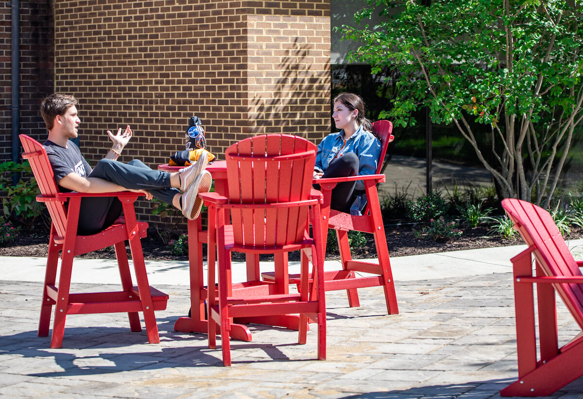 New Patio Expands Outdoor Seating Adirondack chairs, tables, and future fire pit make for a great place to study and gather