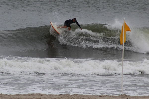 Henkel Family Chair in International Affairs and Professor of Political Science Eric K. Leonard, Ph.D. shown surfing. 