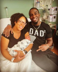 Bryce Mitchell, his wife and their newborn baby