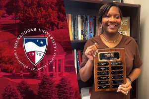 Yolanda Gibson holding United Way NSV Volunteer of the Year Award