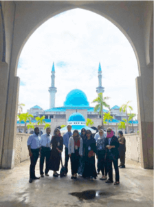 Shenandoah University and Bridgewater College delegates stand outside International Islamic University Malaysia (IIUM)