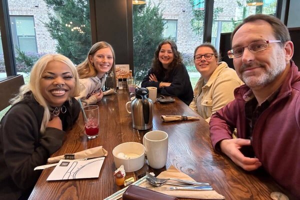 SU Film Majors enjoy breakfast with Joseph P. Genier, Executive Producer of the Paramount+ show, “Wolf Pack,” premiering this January. Elijah Immanuel, Rachel Apostolico, Madelyn Claire Turner and Shannon Forbes have spent the week as interns on the show, experiencing life on set in the professional film and TV world.