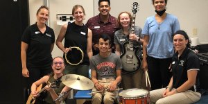 Shenandoah University music therapy and physical therapy students work with a pediatric patient