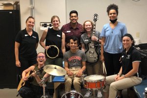 Shenandoah University music therapy and physical therapy students work with a pediatric patient