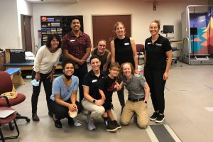 Shenandoah University music therapy and physical therapy students work with a pediatric patient