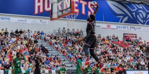 A Harlem Globetrotters player throws down a slam dunk during an event at Shenandoah University in 2021