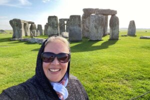 Shenandoah University Director of Transformative Teaching & Learning Karrin Lukas, Ph.D., at Stonehenge (with the stones in the background)