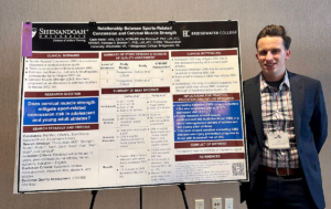 Shenandoah University athletic training student Cade Watts stands with the poster for his research that won an award at the 2023 Virginia Athletic Trainers' Association Annual Meeting in Harrisonburg, Virginia, on Jan. 13-15.