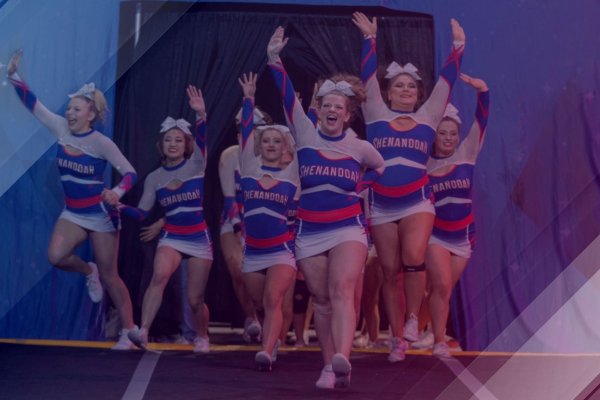 Cheerleaders Running Through a Curtin