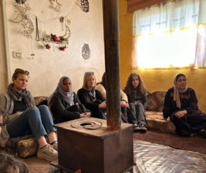 Members of Shenandoah University's Zero Hunger team sit in a home located in an impoverished section of Irbid, Jordan