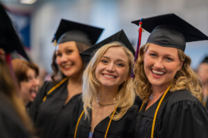 Shenandoah University graduates smile for the camera during Commencement 2023