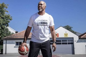 Jamal Atkins '01 with basketball (alumni profile)