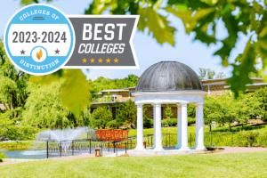 The gazebo and fountain in Sarah's Glen with the Colleges of Distinction 2023-24 badge