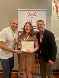 Shenandoah University Professor of Hispanic Studies Andrea Smith , Ph.D., receives her award from AATSP and Dr. Jorge Arbujas Silva, a director for Vista Higher Learning (on Smith’s right) at the historic Hotel Abba Fonseca in Salamanca on June 26.
